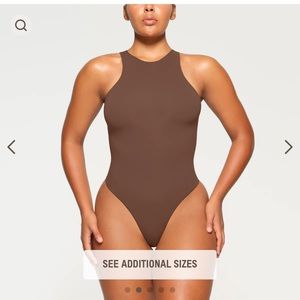 SKIMS fits everybody High Neck Bodysuit in Jasper which is a dark brown